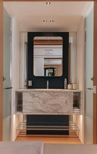 a bathroom with a sink and a mirror aboard LEGEND Yacht for Sale