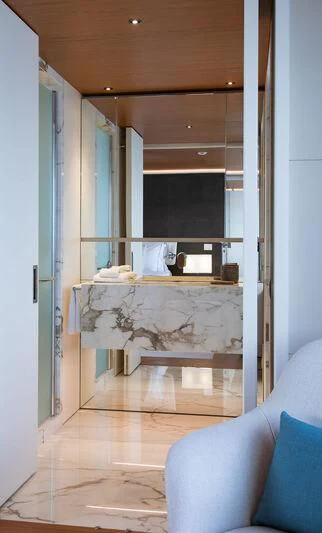 a room with a couch and a fireplace aboard LEGEND Yacht for Sale