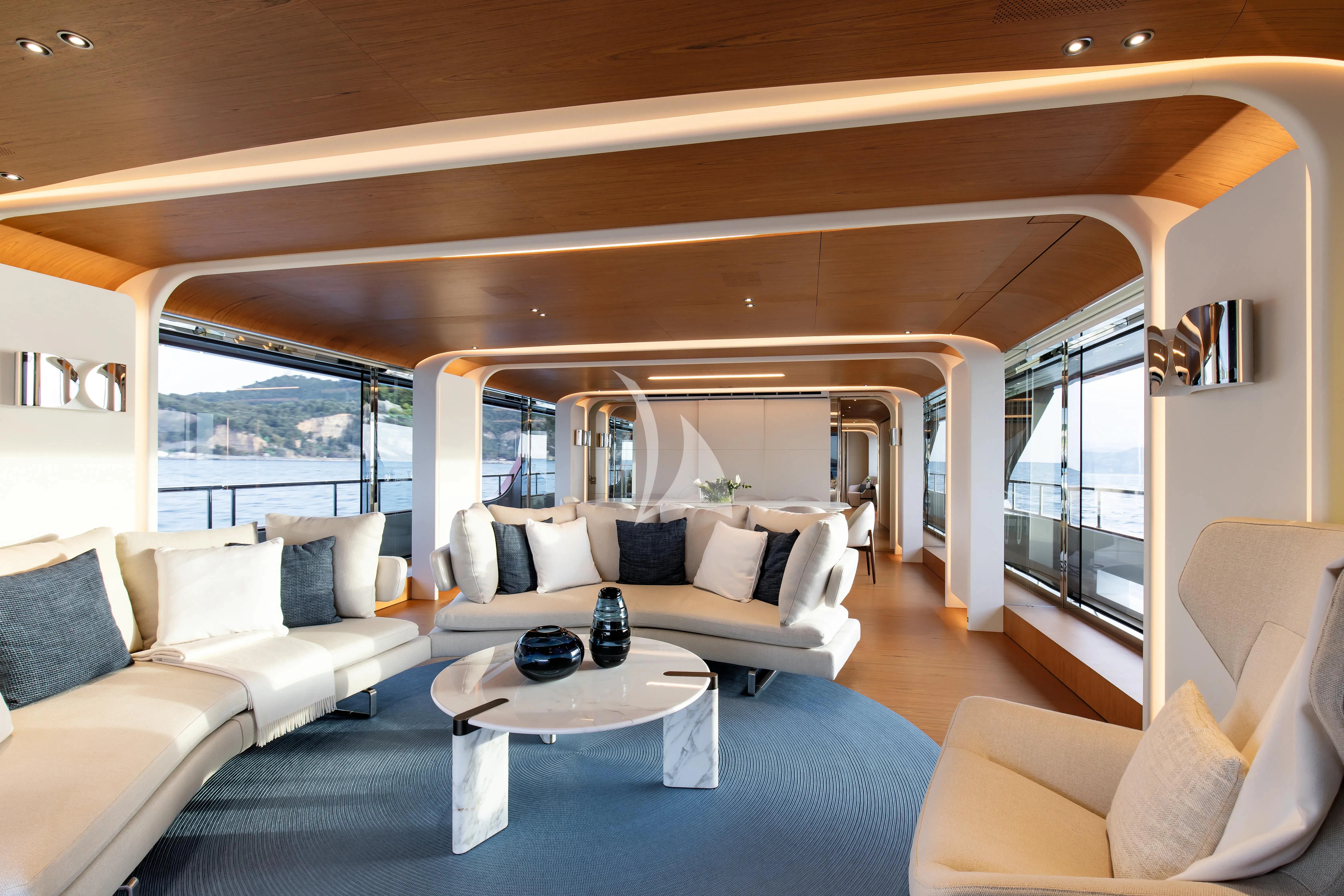 a living room with a large window aboard LEGEND Yacht for Sale