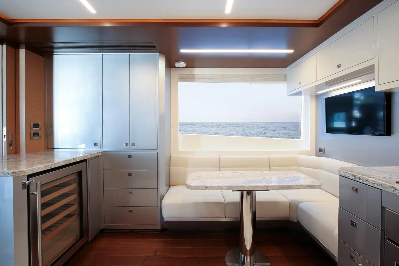 a kitchen with white cabinets aboard CHILLAXIN' Yacht for Sale