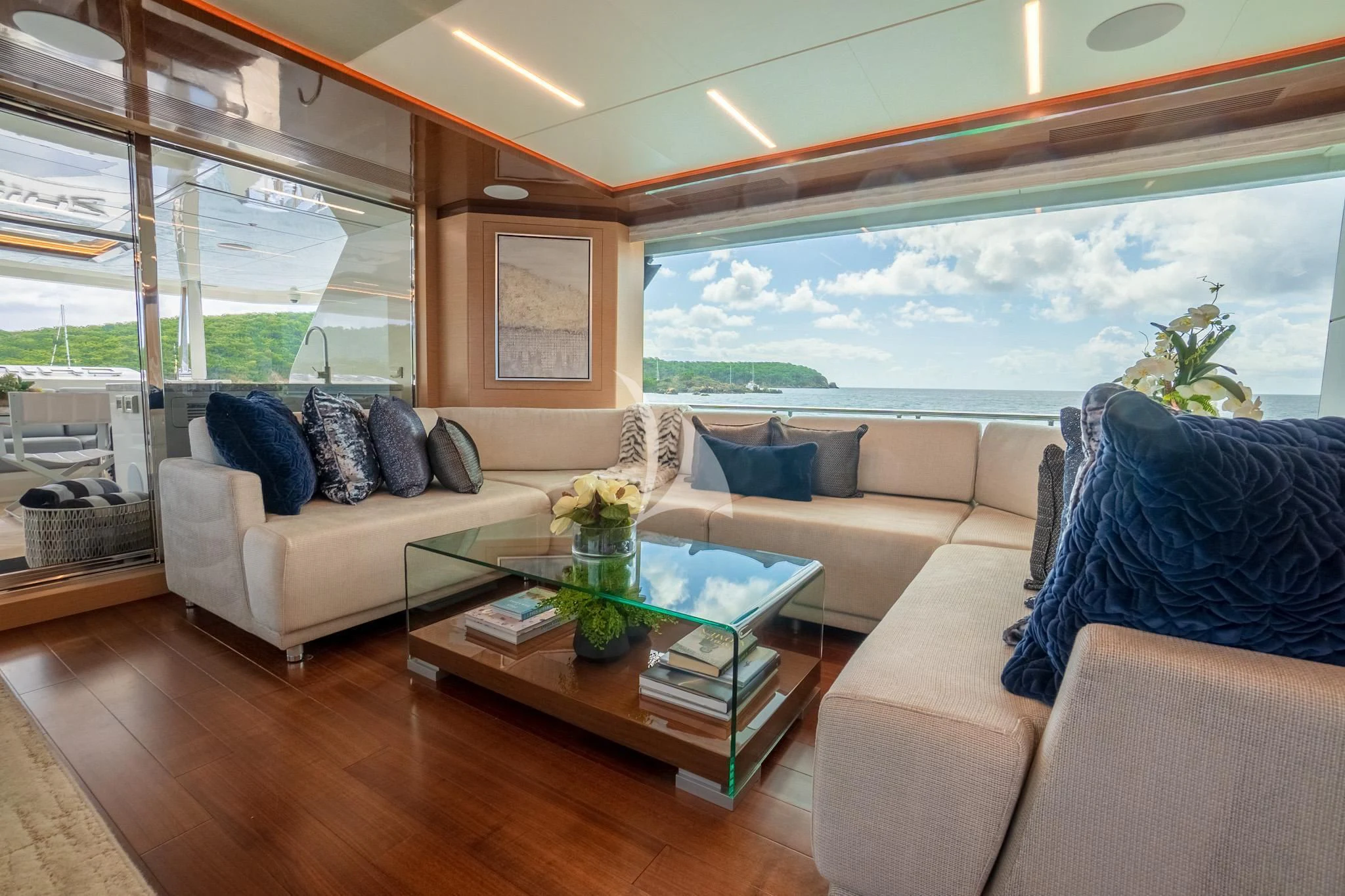 a living room with a large window aboard CHILLAXIN' Yacht for Sale
