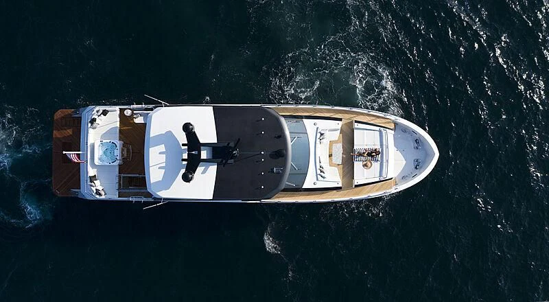 a person standing on a boat aboard CHILLAXIN' Yacht for Sale