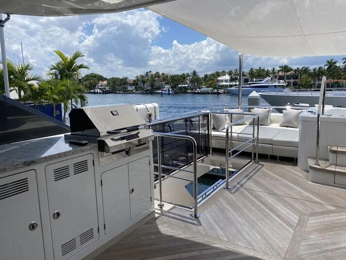 a deck with a pool and a deck with a view of the water aboard CHILLAXIN' Yacht for Sale
