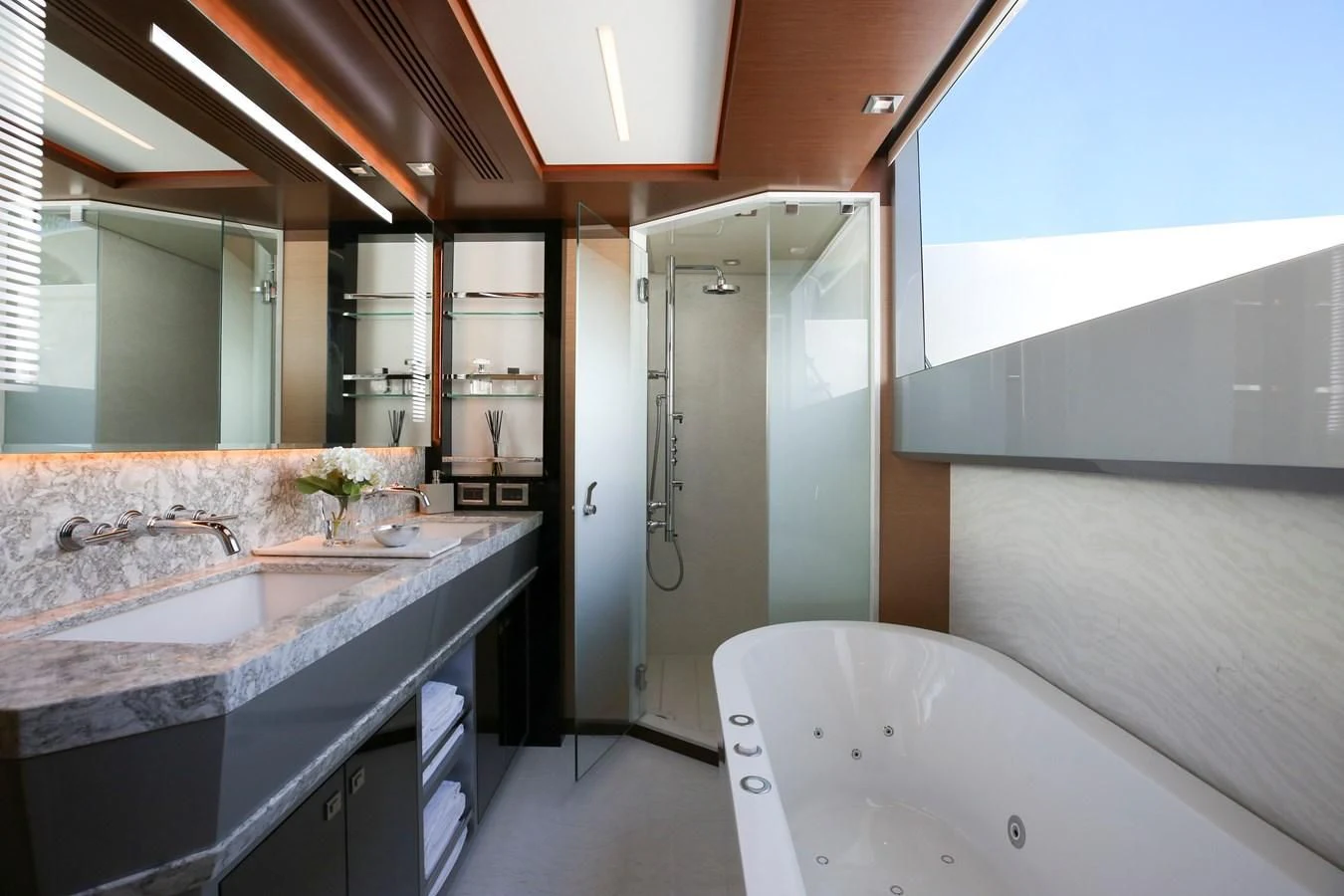 a bathroom with a bathtub and sink aboard CHILLAXIN' Yacht for Sale