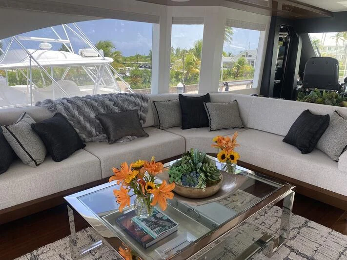 a living room with a couch and a coffee table aboard CHILLAXIN' Yacht for Sale