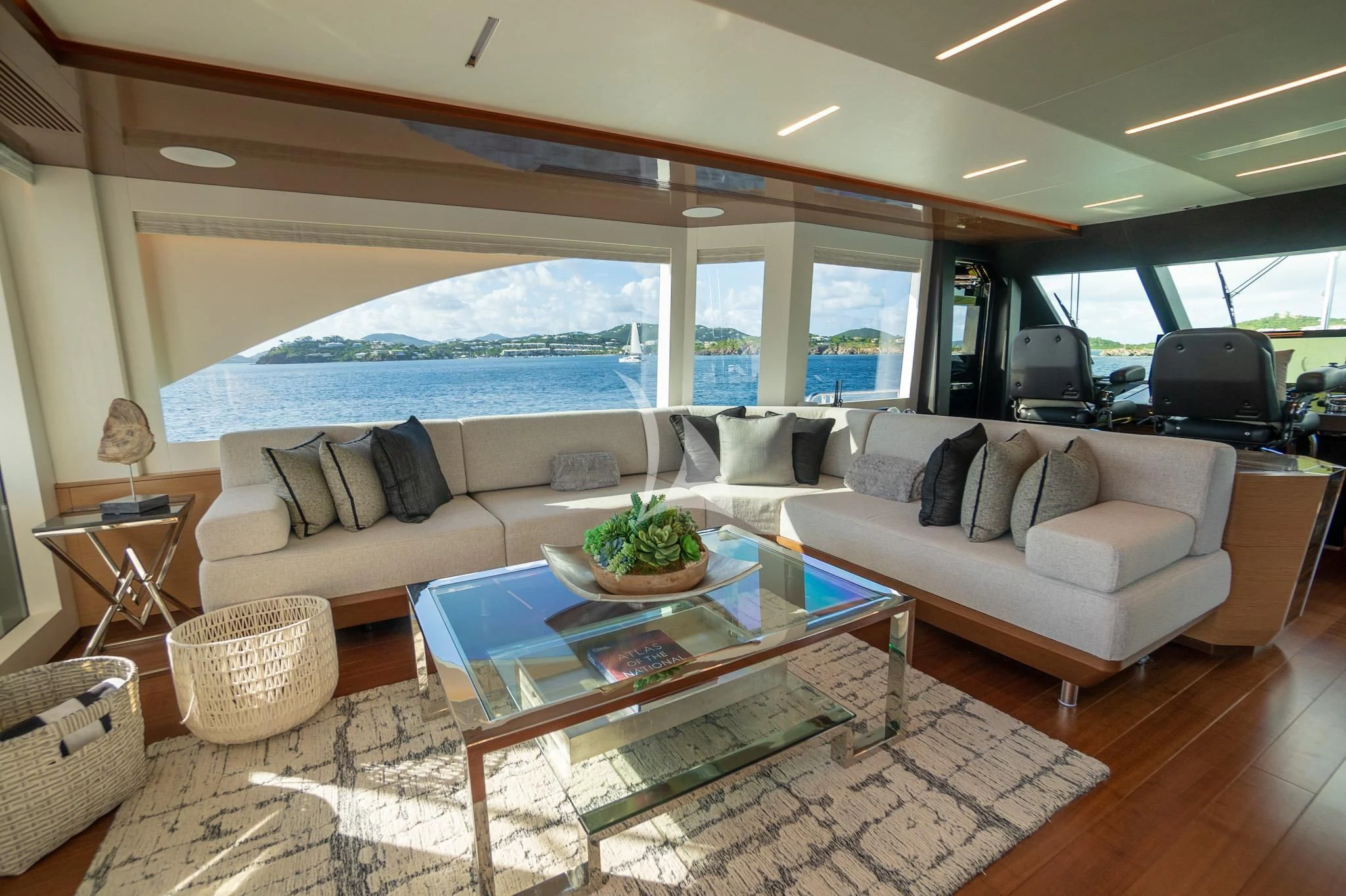 a living room with a large glass window aboard CHILLAXIN' Yacht for Sale