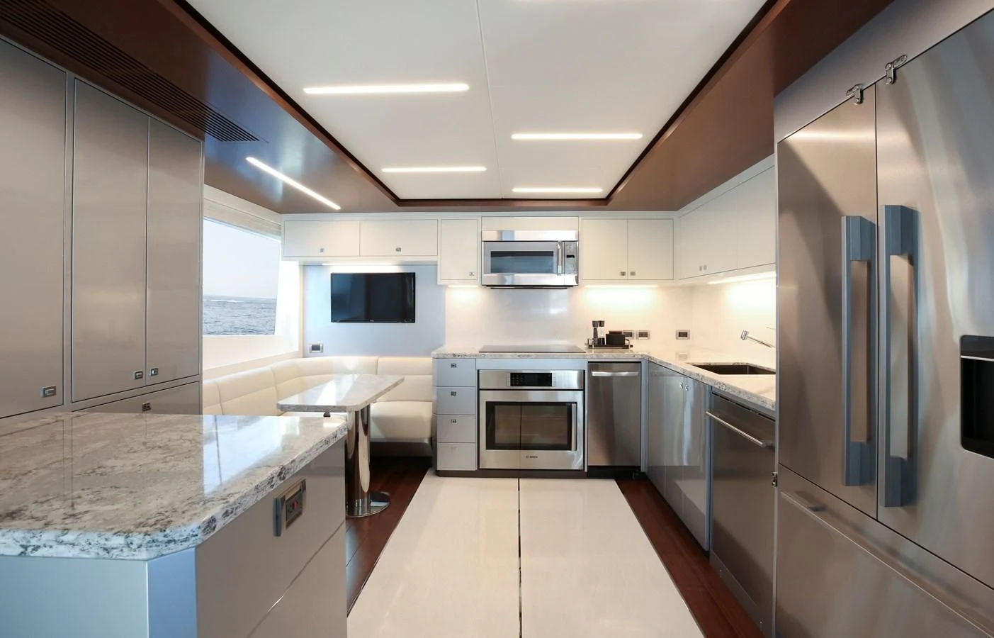a kitchen with stainless steel appliances aboard CHILLAXIN' Yacht for Sale