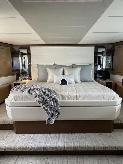 a bed with white sheets aboard CHILLAXIN' Yacht for Sale