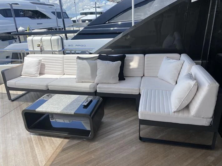 a living room with a couch and a table aboard CHILLAXIN' Yacht for Sale