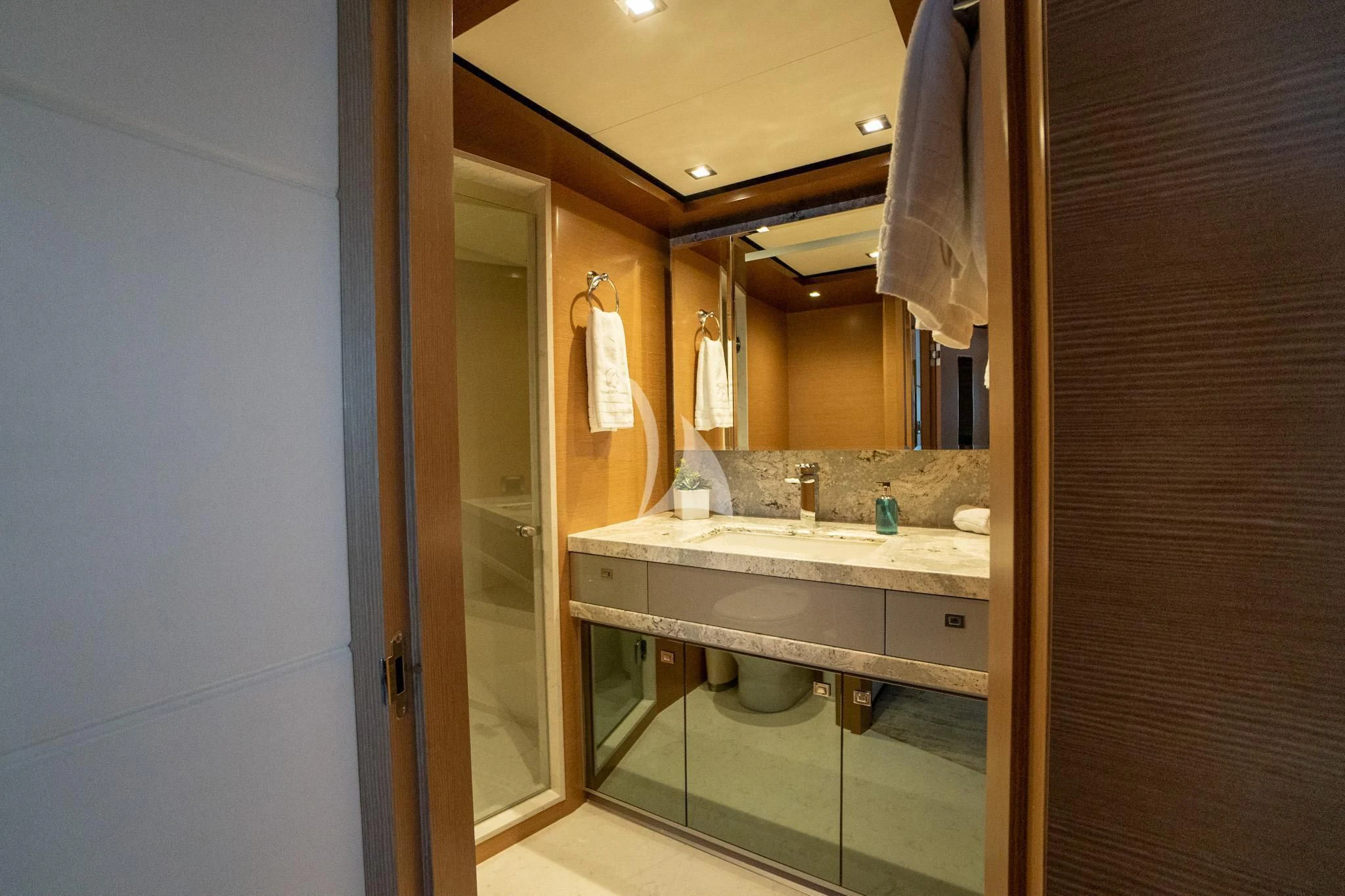 a bathroom with a sink and a mirror aboard CHILLAXIN' Yacht for Sale