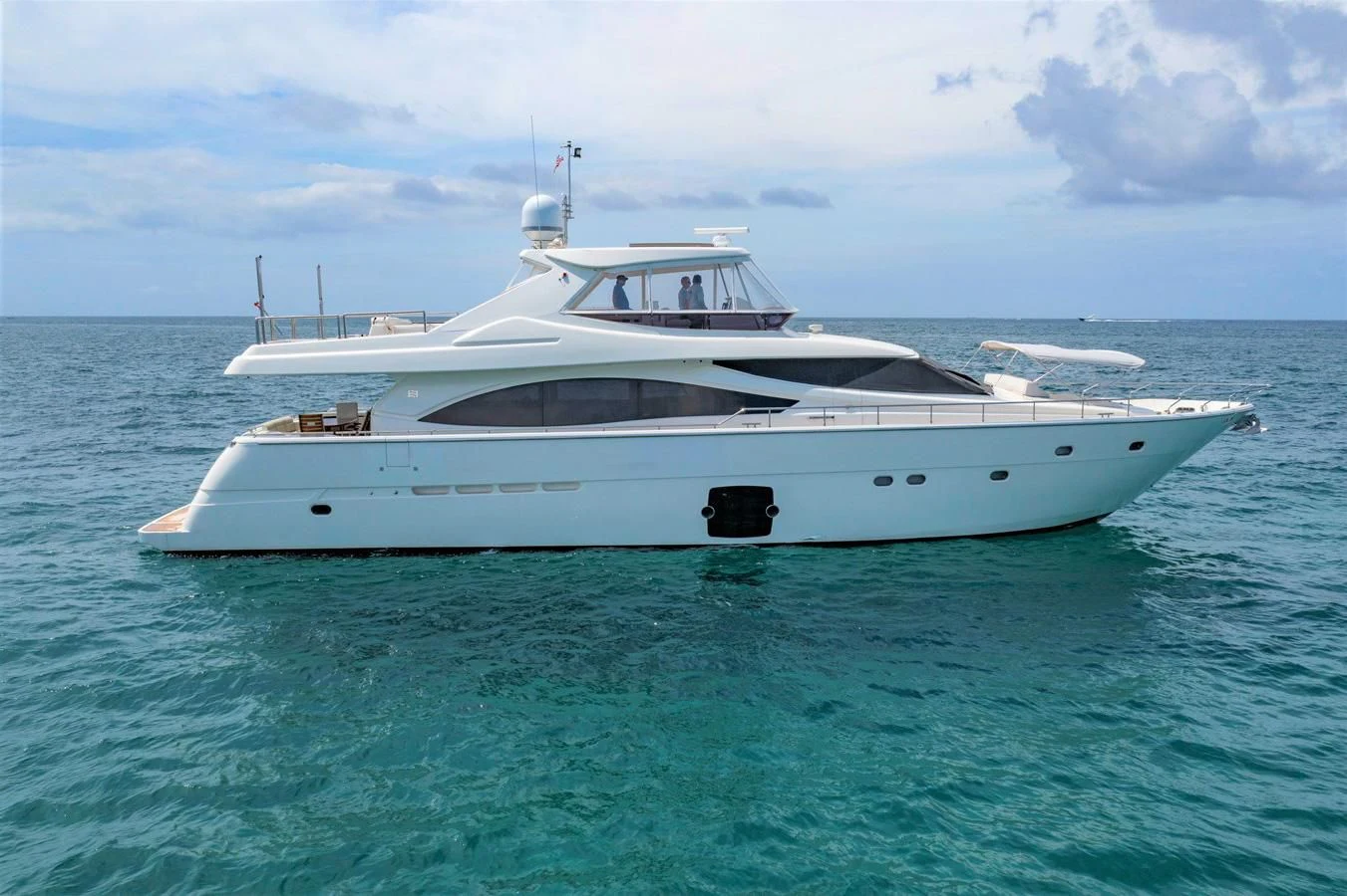 a white yacht in the water aboard MI RX Yacht for Sale