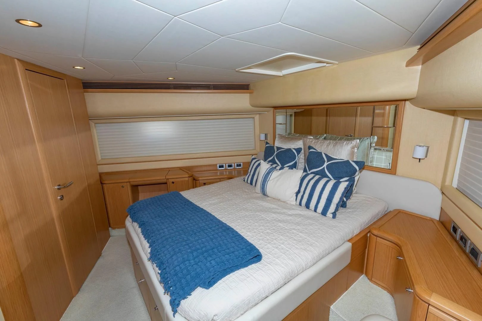 a bedroom with a bed and a desk aboard MI RX Yacht for Sale