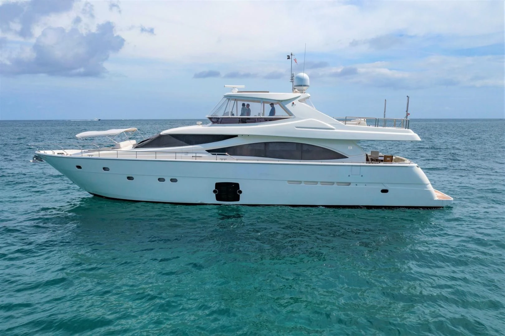 a white yacht in the water aboard MI RX Yacht for Sale