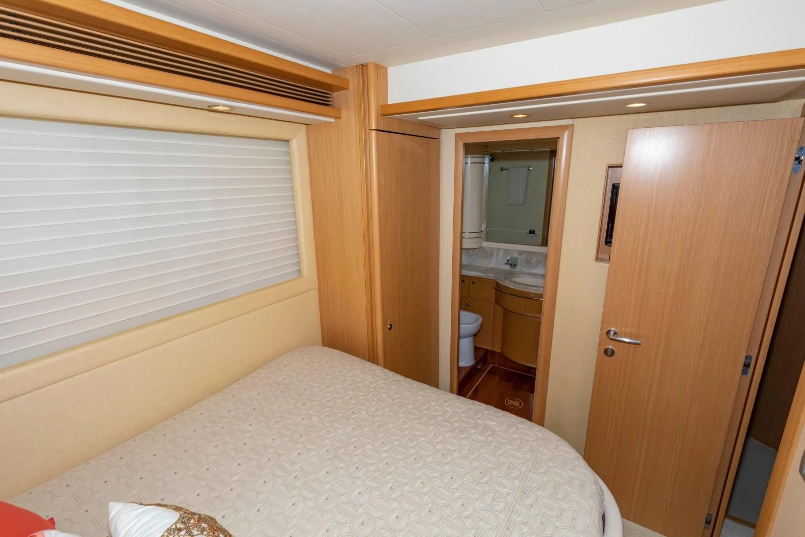a bedroom with a large bed aboard MI RX Yacht for Sale