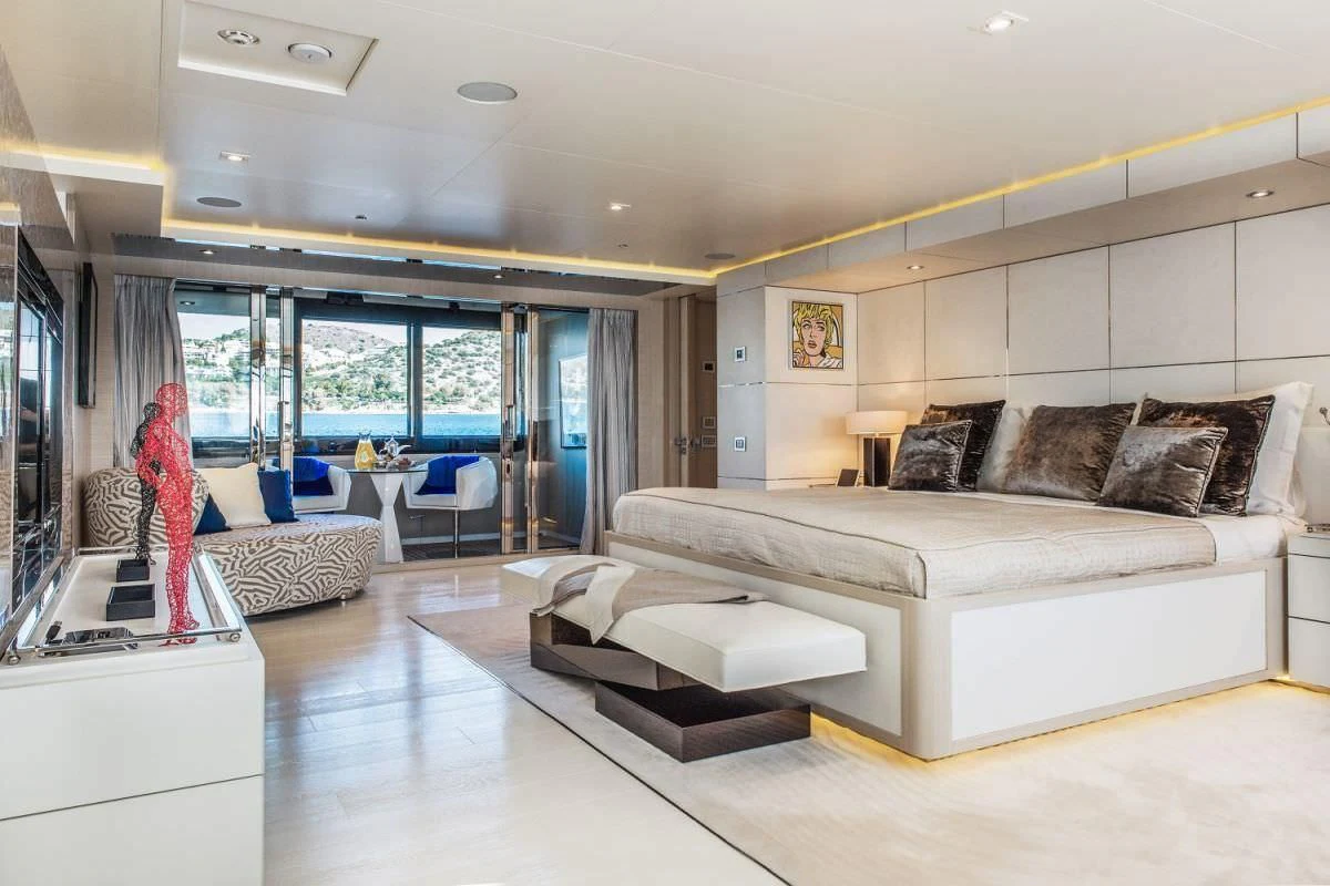 a living room with a couch and a table aboard ELENI Yacht for Sale