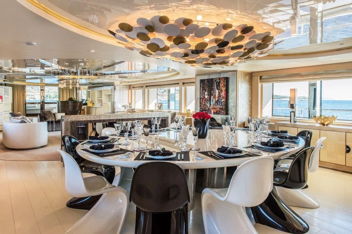 a large kitchen with a large table aboard ELENI Yacht for Sale