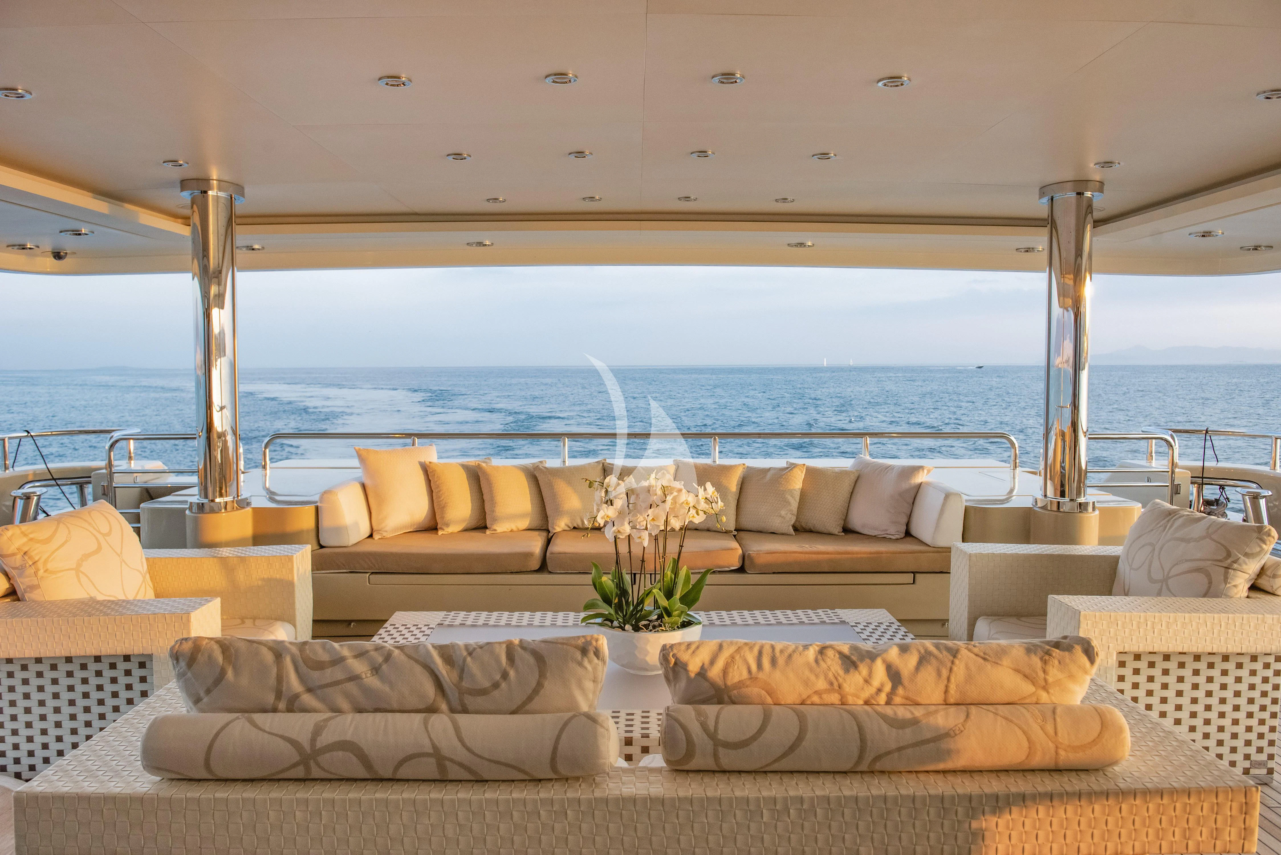 a room with a couch and a table and chairs aboard ELENI Yacht for Sale
