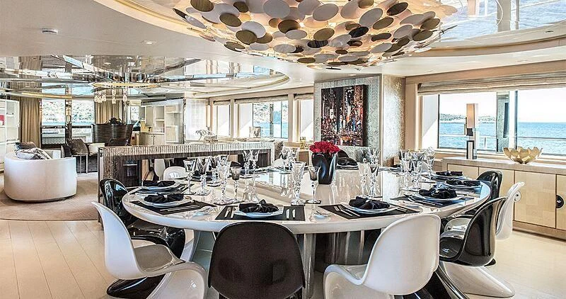 a large kitchen with a large table aboard ELENI Yacht for Sale