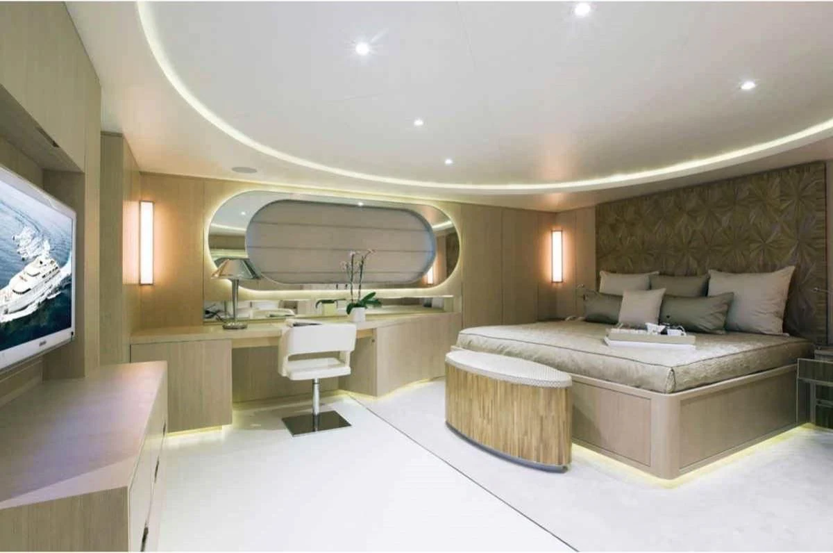 a room with a bed and a couch aboard ELENI Yacht for Sale