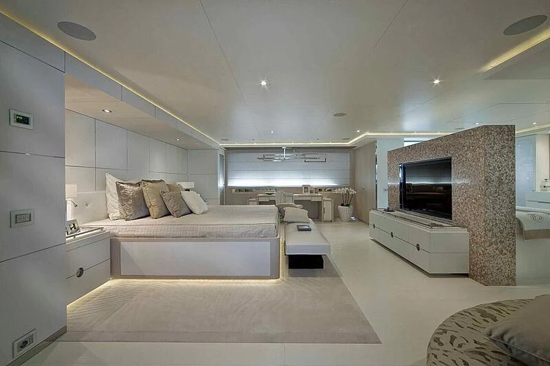 a bedroom with a bed and a tv aboard ELENI Yacht for Sale