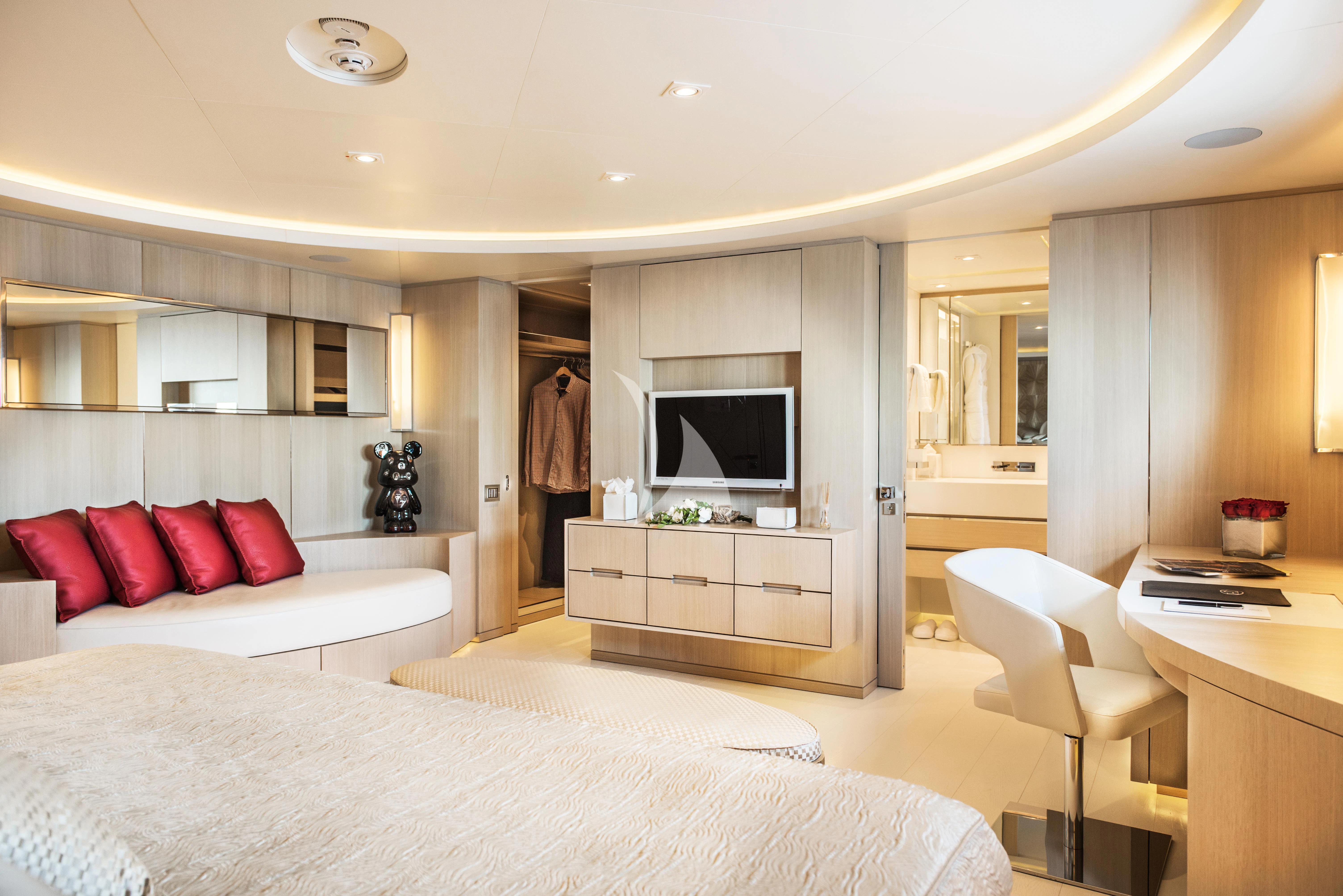 a modern bedroom with white furniture aboard ELENI Yacht for Sale