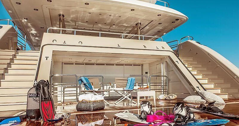 a boat with a ladder and a chair on the deck aboard ELENI Yacht for Sale