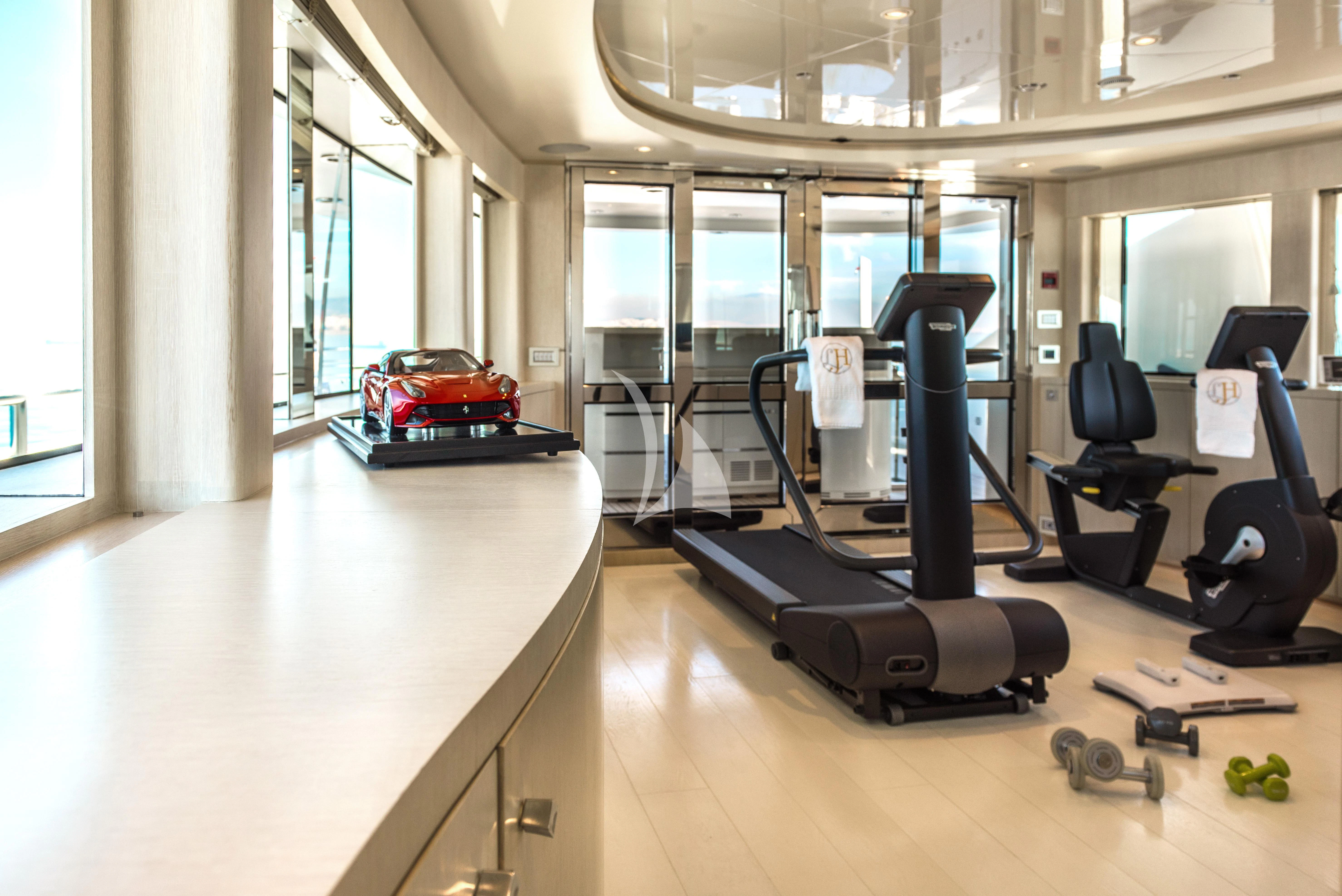 a gym with exercise equipment aboard ELENI Yacht for Sale