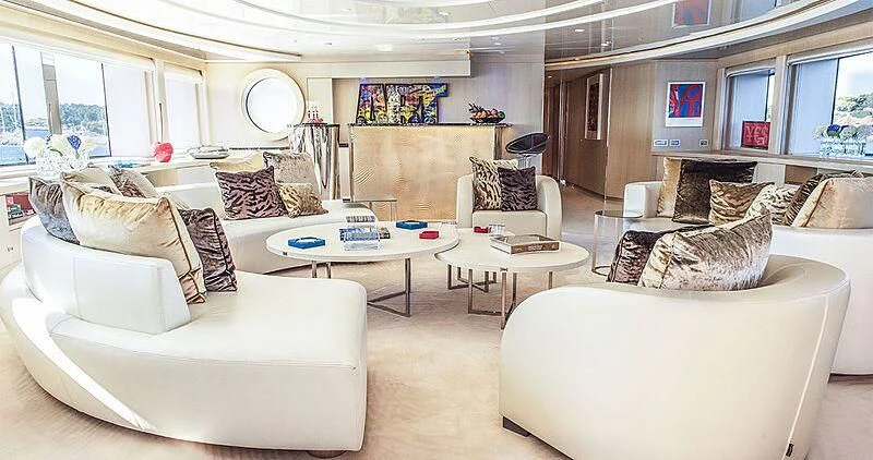 a living room with white furniture aboard ELENI Yacht for Sale