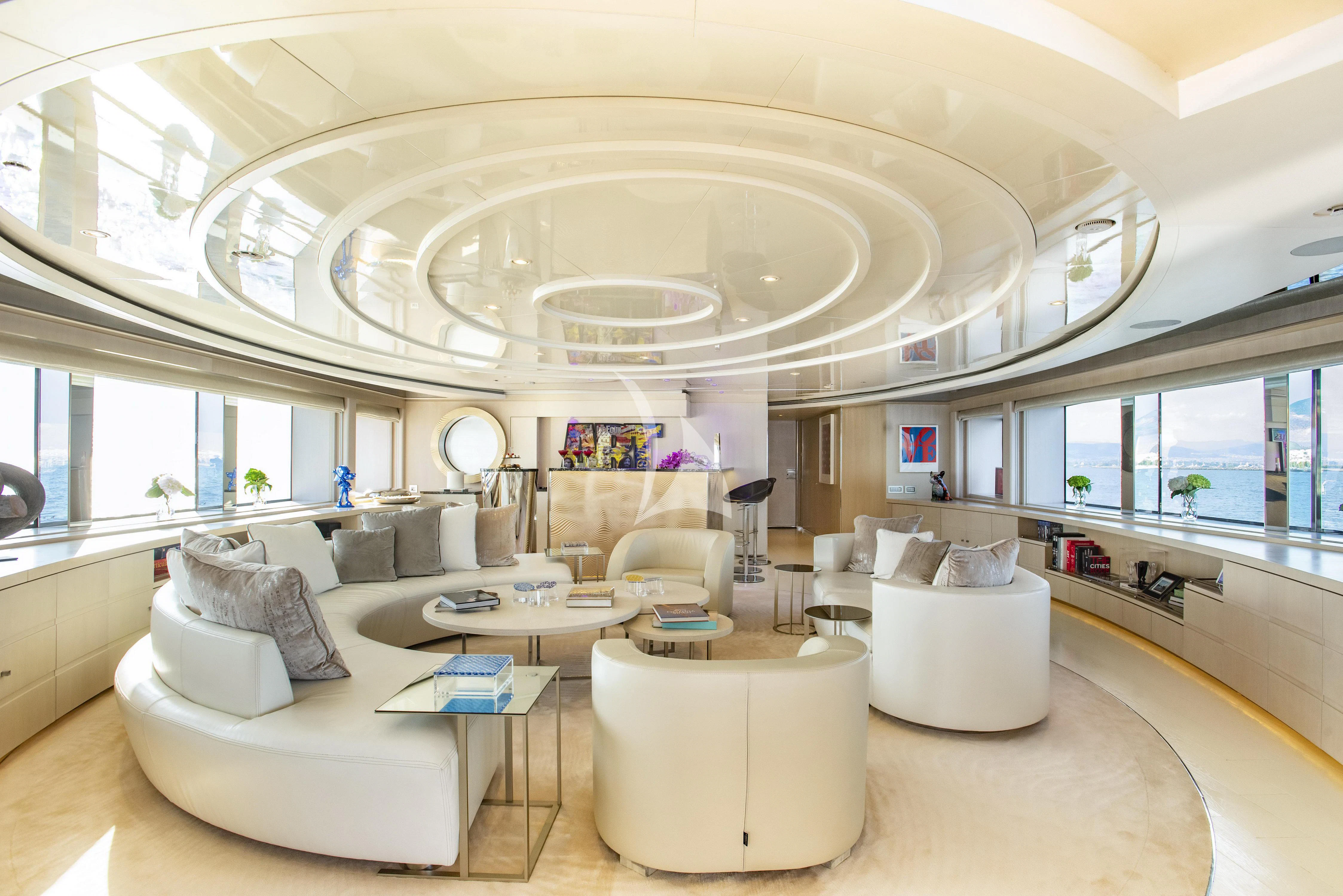 a large white room with a large chandelier aboard ELENI Yacht for Sale
