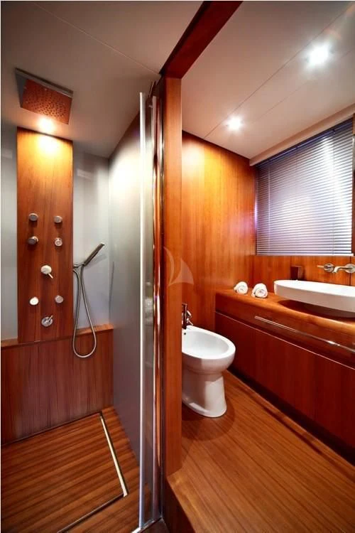 a bathroom with a toilet and sink aboard FUNSEA Yacht for Sale