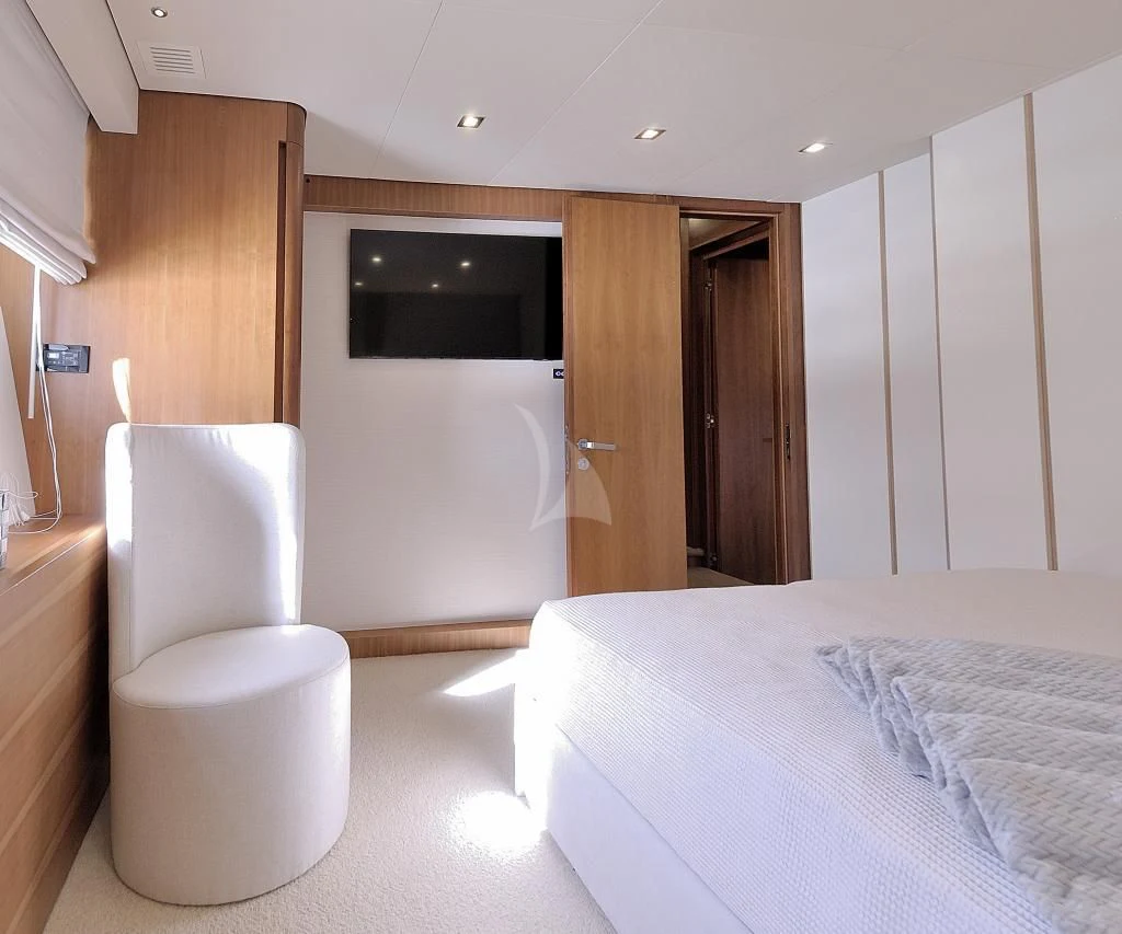 a modern looking bedroom with a bed aboard FUNSEA Yacht for Sale