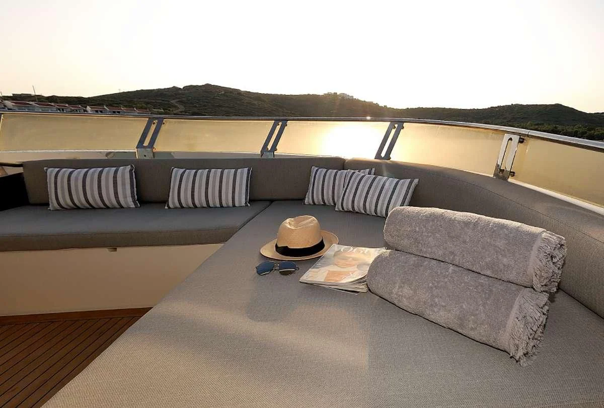 a couch and a table on a boat aboard FUNSEA Yacht for Sale