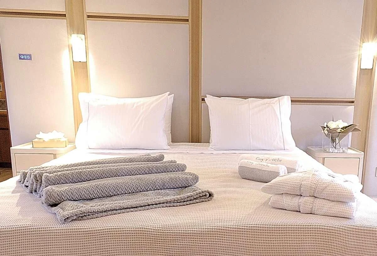 a hotel room with a bed aboard FUNSEA Yacht for Sale