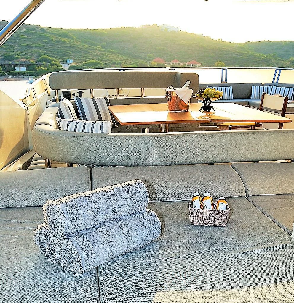a couch and a coffee table aboard FUNSEA Yacht for Sale