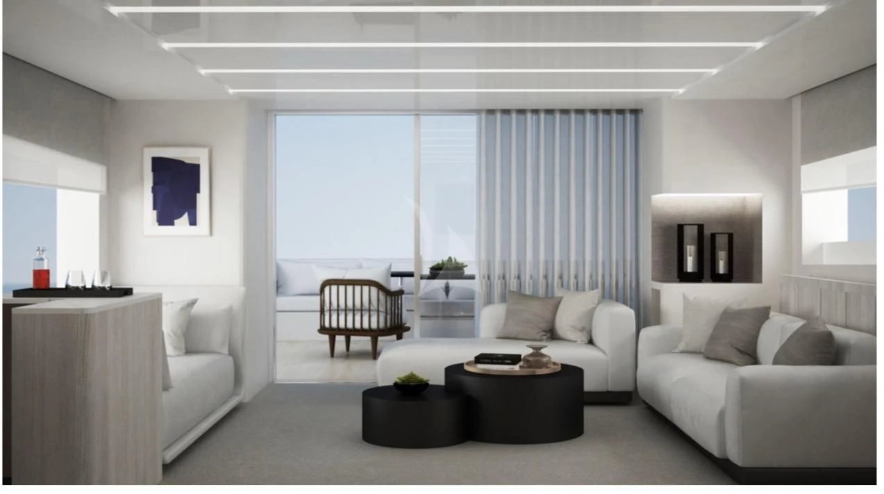 a living room with white furniture aboard FUNSEA Yacht for Sale