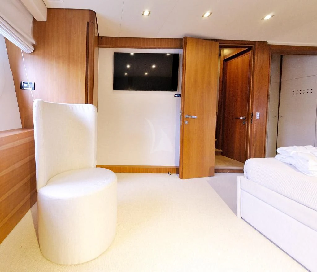 a room with a bed and a tv aboard FUNSEA Yacht for Sale