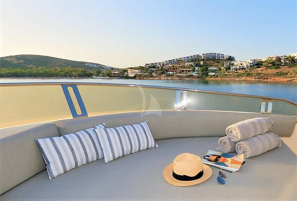 a couch on a deck overlooking a body of water aboard FUNSEA Yacht for Sale
