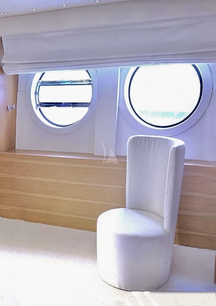 a white chair in a room aboard FUNSEA Yacht for Sale