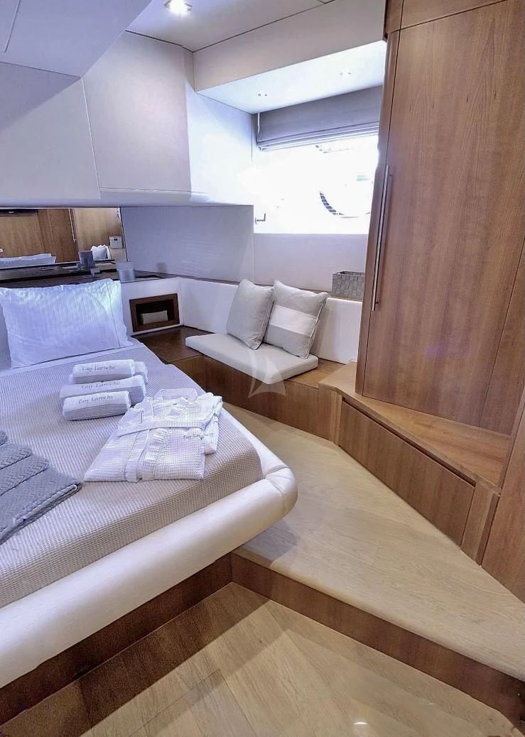 a room with a bed and a couch aboard FUNSEA Yacht for Sale