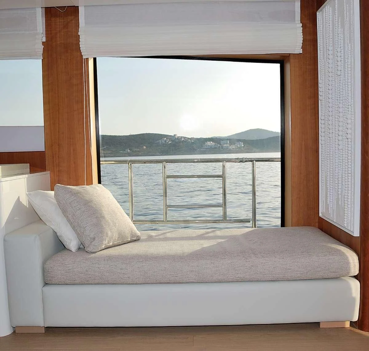 a bed with a window aboard FUNSEA Yacht for Sale