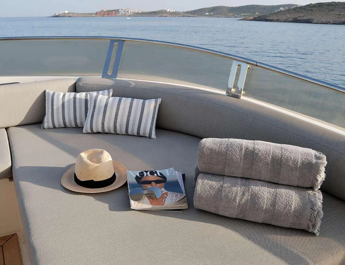 a pool with a hat and a towel on it aboard FUNSEA Yacht for Sale