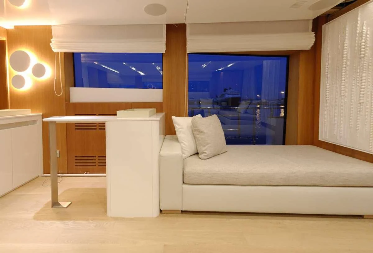 a white couch in a room aboard FUNSEA Yacht for Sale