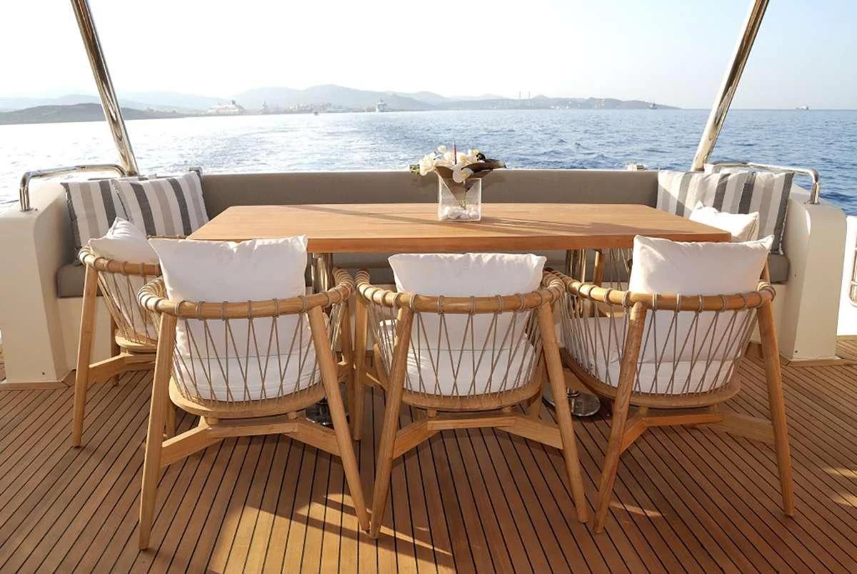 a table set for a dinner on a boat aboard FUNSEA Yacht for Sale