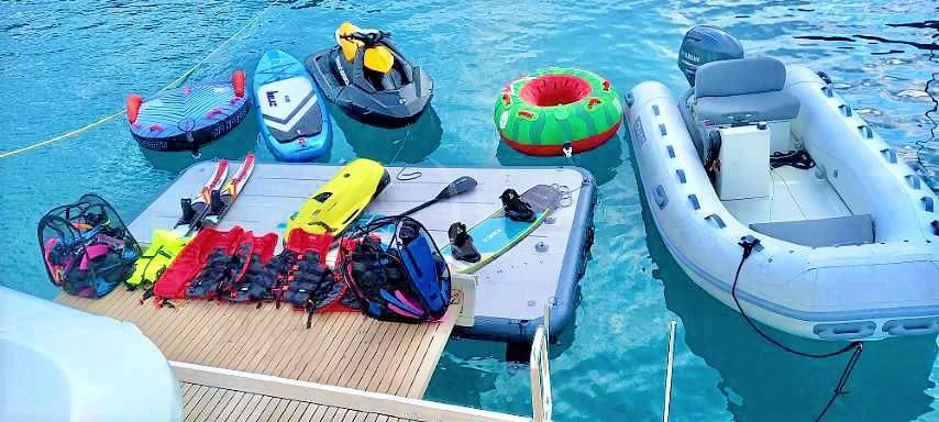 a boat with a group of boats on it aboard FUNSEA Yacht for Sale