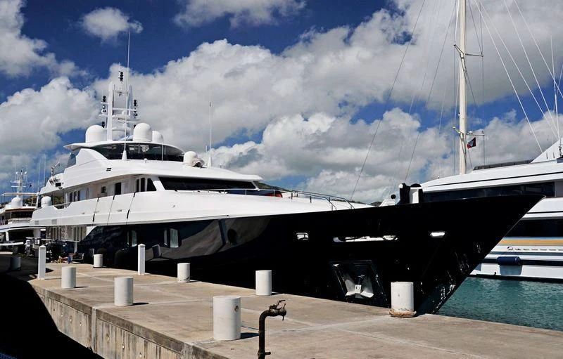 a large boat docked at a pier aboard ODESSA Yacht for Charter