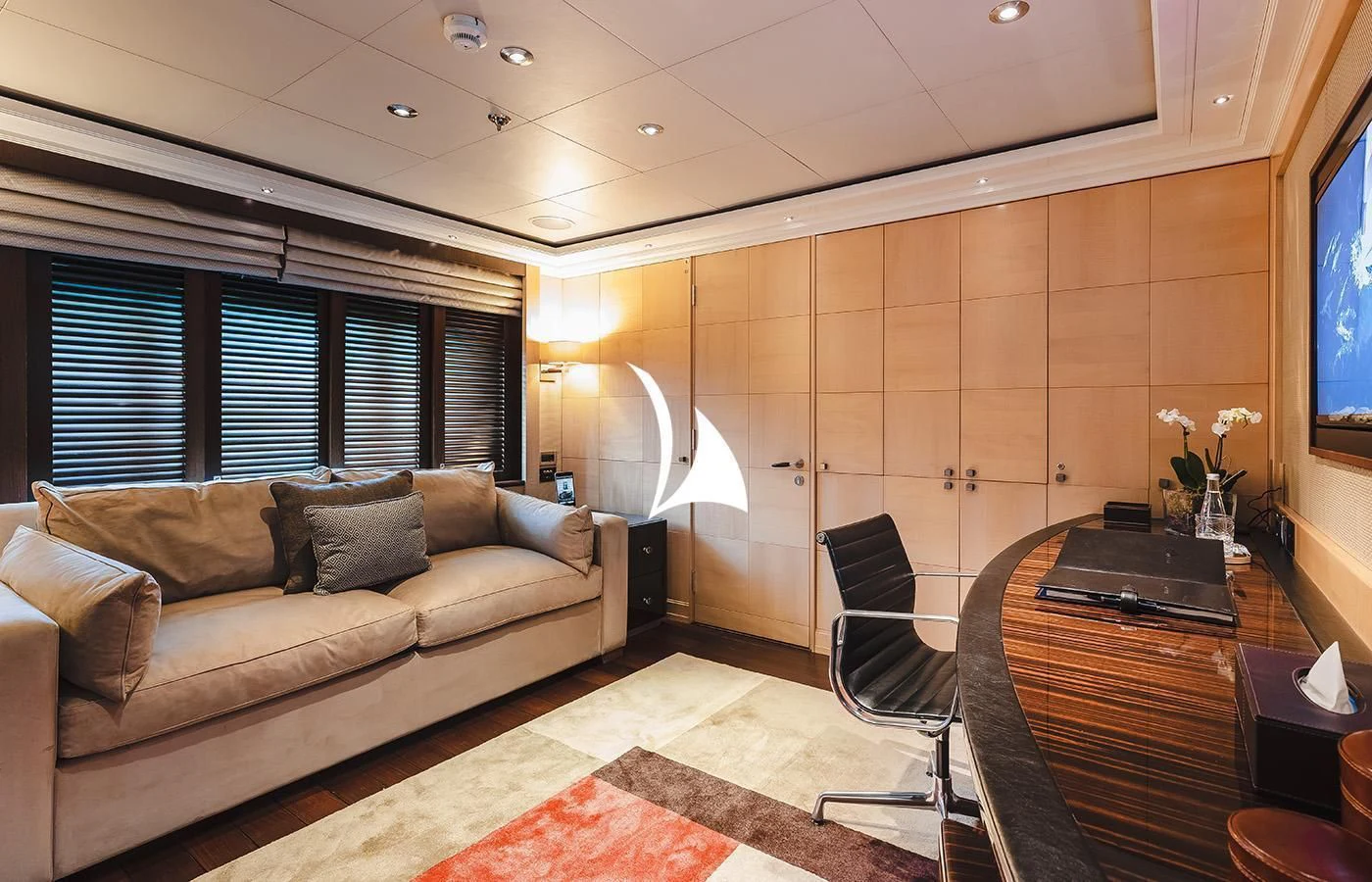 a living room with a couch and a table aboard ODESSA Yacht for Charter