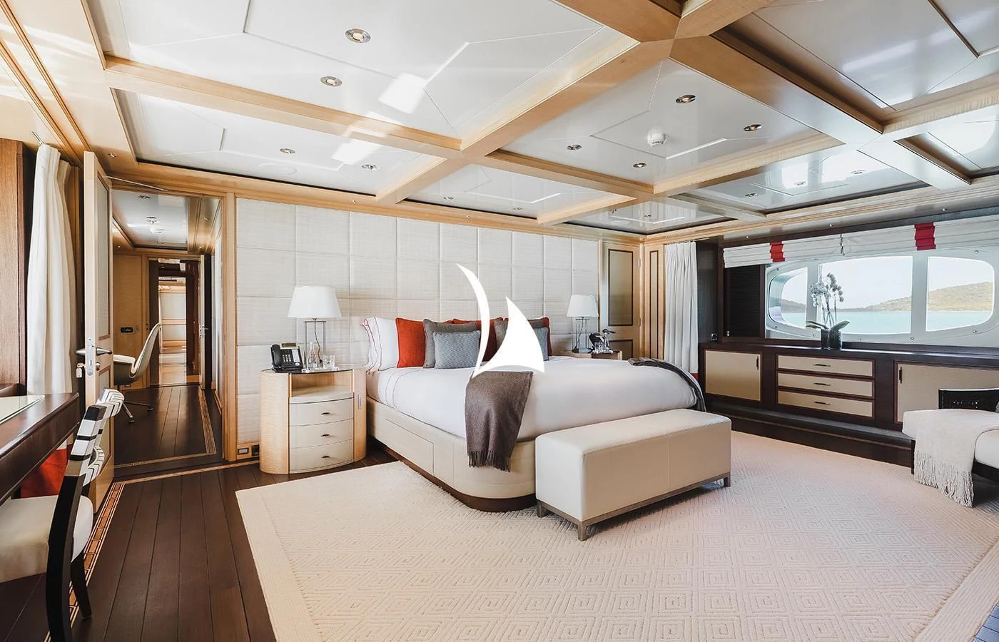 a large modern bedroom with a large bed and a large window aboard ODESSA Yacht for Charter