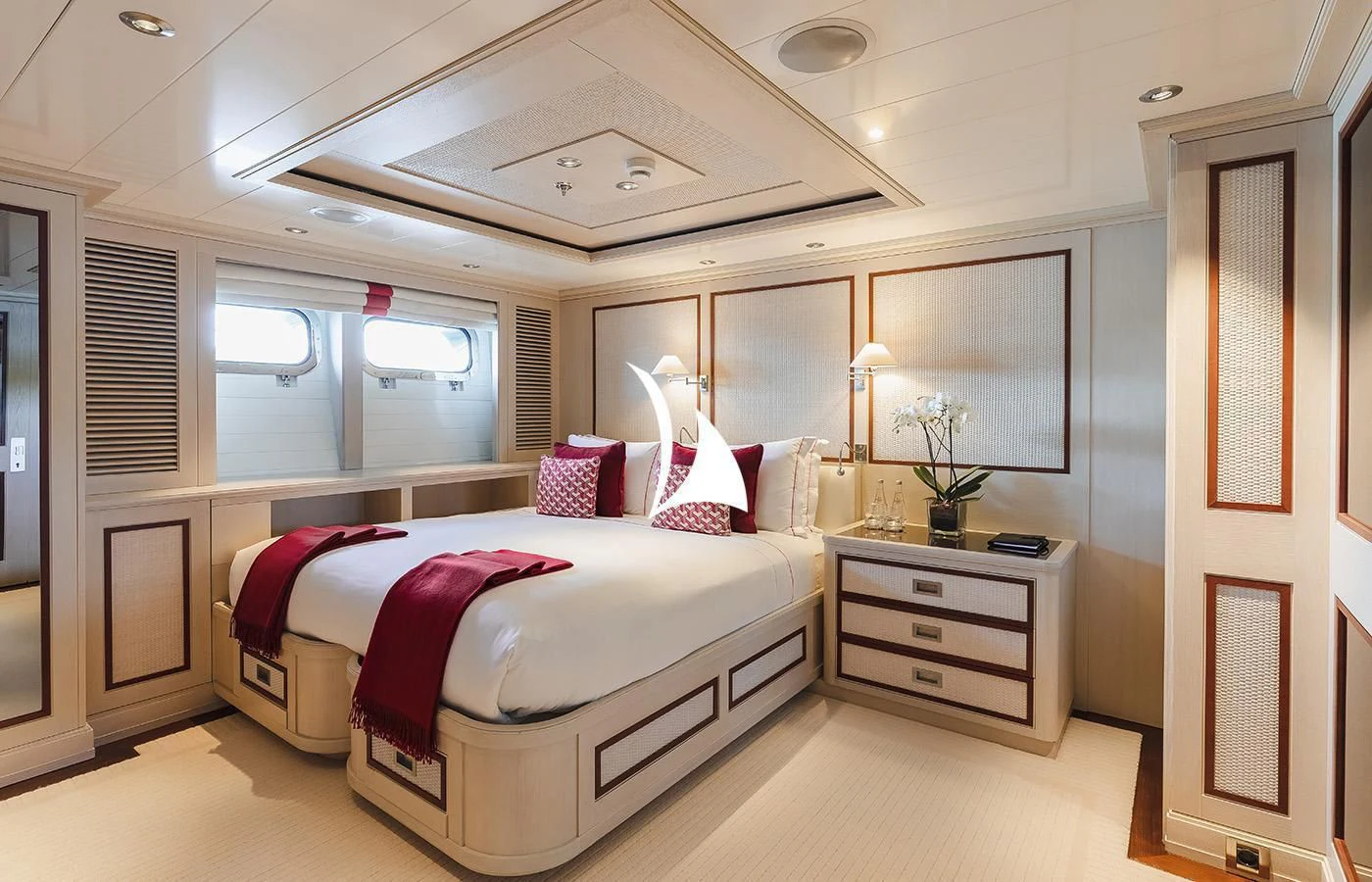 a bedroom with a bed and a desk aboard ODESSA Yacht for Charter