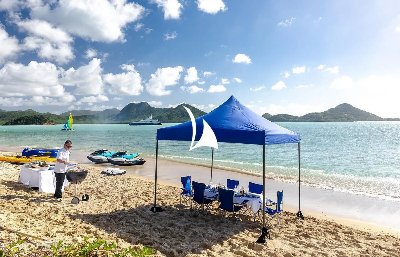 a person sitting on a beach aboard ODESSA Yacht for Charter