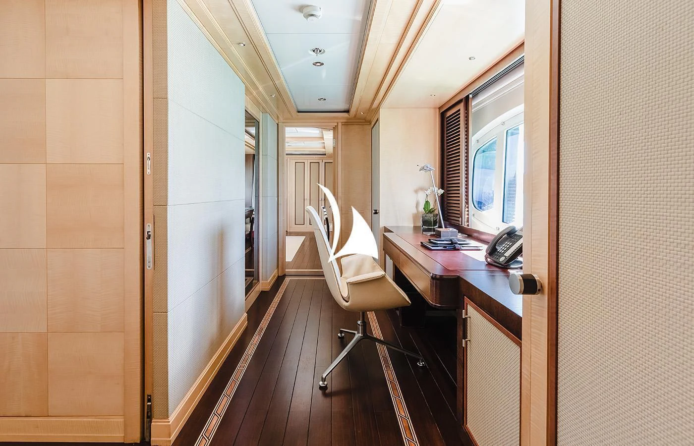 a room with a desk and a chair aboard ODESSA Yacht for Charter